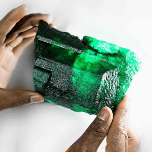 Large Raw Emerald Stone in Hands