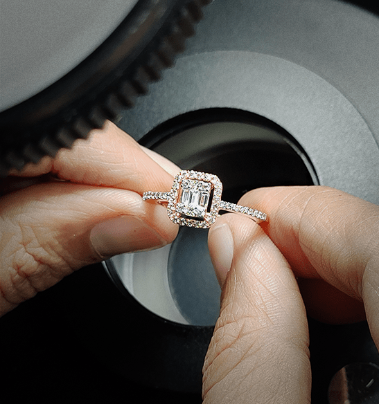 Diamond ring under the grading machine used on the qualified jewellery specialist course page.
